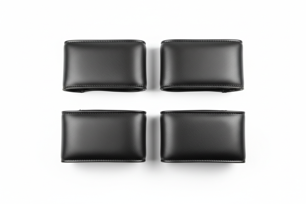 UltraTouch leatherette armrest cover pair flat-lay on white background showing stitched seam edge and surface texture