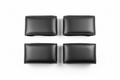 UltraTouch leatherette armrest cover pair flat-lay on white background showing stitched seam edge and surface texture