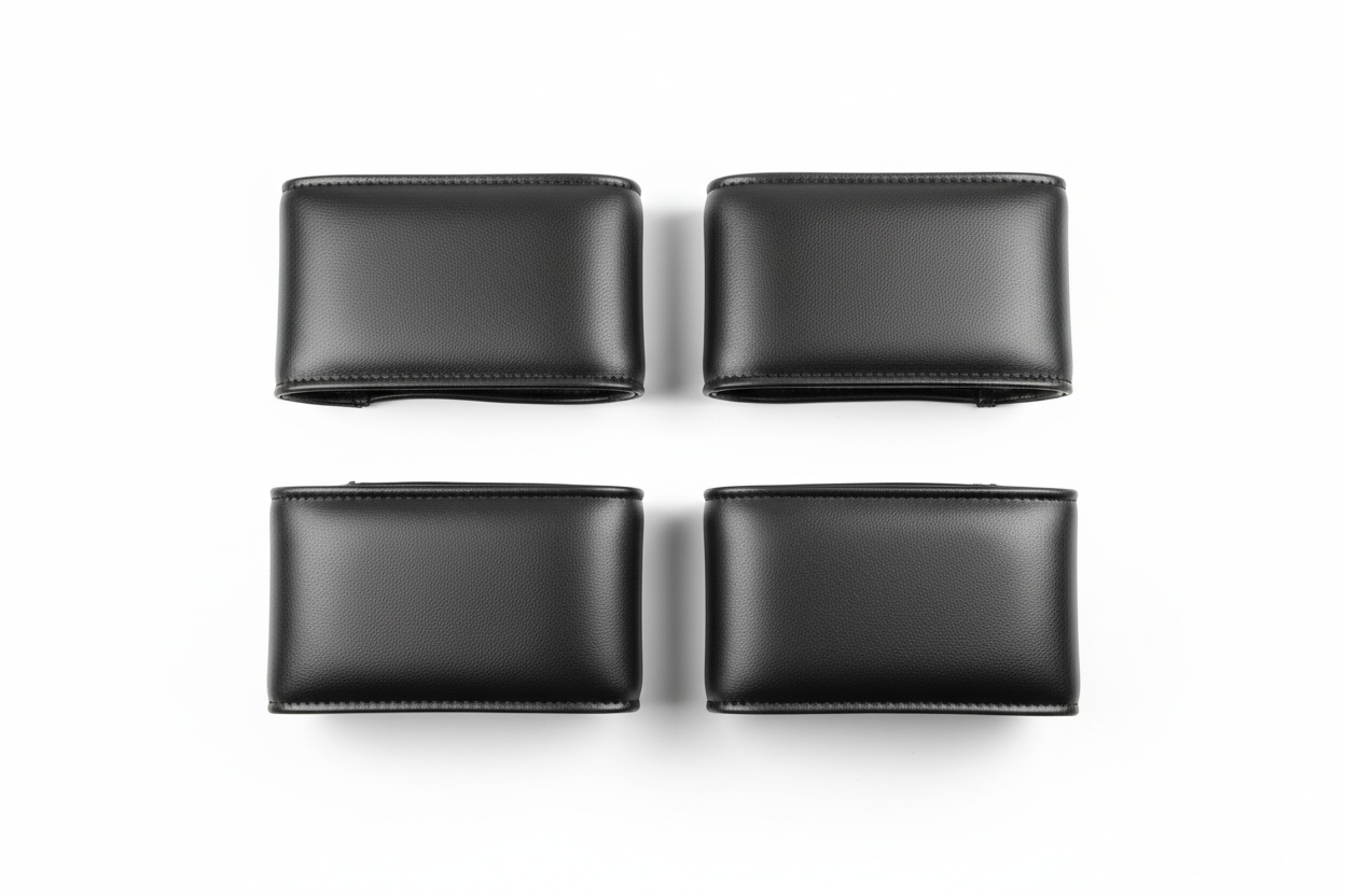 UltraTouch leatherette armrest cover pair flat-lay on white background showing stitched seam edge and surface texture